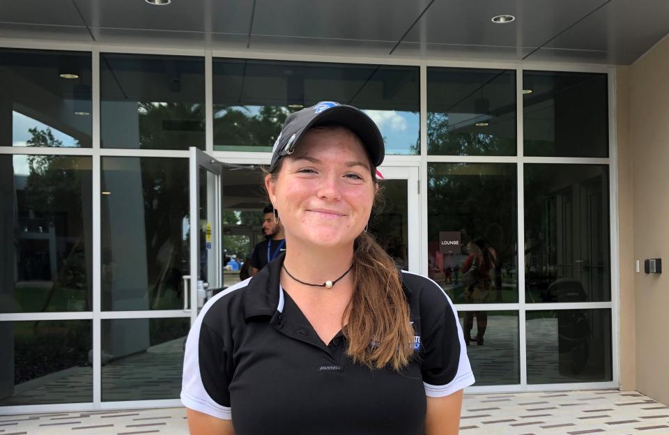 Madison Tenore, a Daytona State College student, stands in front of the school's new residence hall, the first on the Daytona Beach campus. Tenore, a member of the women's golf team, will live there starting in August.