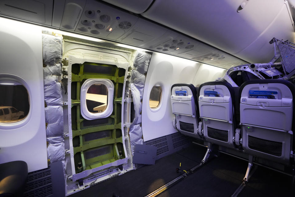 File - A door plug area of an Alaska Airlines Boeing 737 Max 9 aircraft awaiting inspection is pictured with paneling removed at the airline's facilities at Seattle-Tacoma International Airport on Jan. 10, 2024, in SeaTac, Wash. Boeing 737 Max 9 jetliners will carry passengers in the United States again, starting this weekend, for the first time since they were grounded after a panel blew out of the side of one of the planes. (AP Photo/Lindsey Wasson, File)