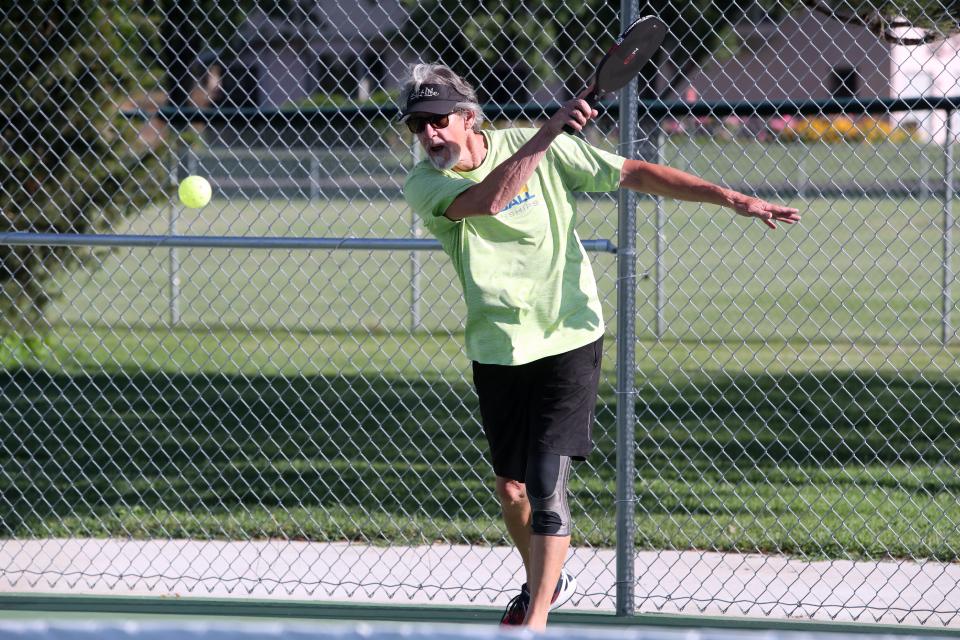 Terry Osborn hits the ball during a pickleball game at Manor Park in Aberdeen on June 30.