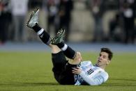 Argentina's Lionel Messi falls during the Copa America 2015 final soccer match against Chile at the National Stadium in Santiago, Chile, July 4, 2015. REUTERS/Jorge Adorno