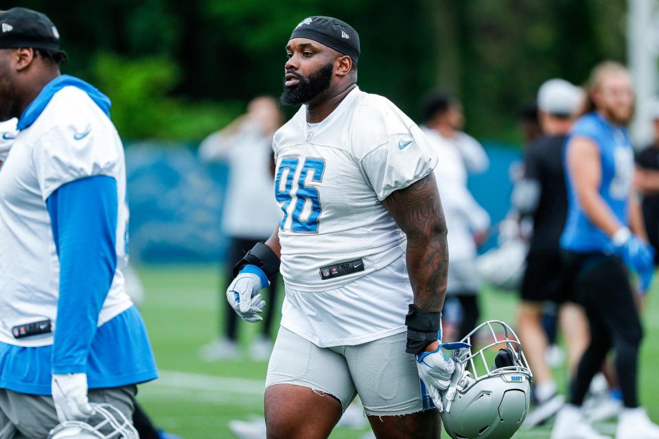 Detroit Lions defensive end Jashon Cornell (96) warms up during mini camp at the practice facility in Allen Park on Tuesday, June 7, 2022.