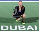 Tennis - Dubai Open - Women's Singles Final - Caroline Wozniacki of Denmark v Elina Svitolina of Ukraine - Dubai, UAE - 25/2/2017 - Elina Svitolina holds her trophy at the end of the match. REUTERS/Stringer