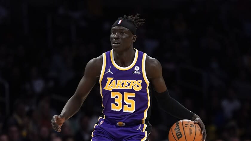 Los Angeles Lakers forward Wenyen Gabriel (35) controls the ball during an NBA basketball game against the Philadelphia 76ers in Los Angeles, Wednesday, March 23, 2022. (AP Photo/Ashley Landis)