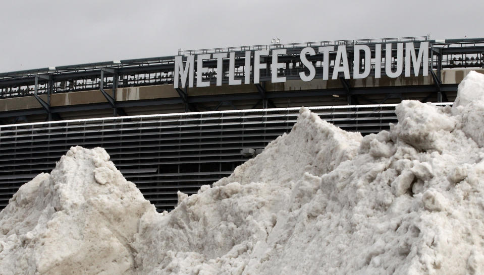 In this Dec. 15, 2013 file photo, a mound of snow is shown outside of MetLife Stadium before an NFL football game between the Seattle Seahawks and the New York Giants, in East Rutherford, N.J. NFL officials may be embracing the notion of a cold-weather Super Bowl, but seriously: What happens if there is, in fact, a snow storm on Feb. 2? (AP Photo/Peter Morgan, File)