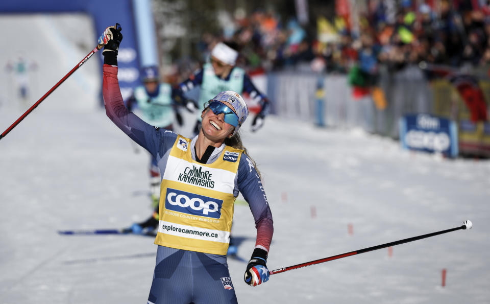 Jessie Diggins, of the United States, celebrates her win in the women's 15km Mass Start freestyle World Cup cross country skiing event in Canmore, Alberta, Friday, Feb. 9, 2024. (Jeff McIntosh/The Canadian Press via AP)