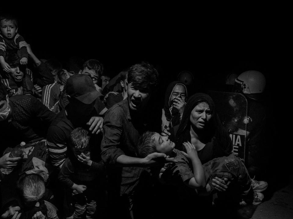 <p>Refugees and migrants arriving on Lesbos, Greece in 2015, are transferred to the Moria refugee camp where they register with authorities before being able to move on. (© Alex Majoli/Magnum Photos) </p>