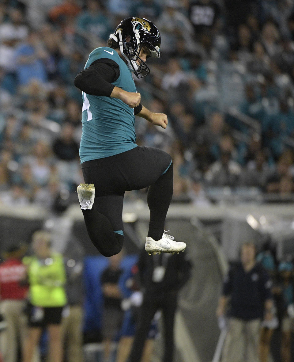 Jacksonville Jaguars kicker Josh Lambo leaps igh into the air after his 48-yard field goal against the Tennessee Titans during the second half of an NFL football game Thursday, Sept. 19, 2019, in Jacksonville, Fla. (AP Photo/Phelan Ebenhack)