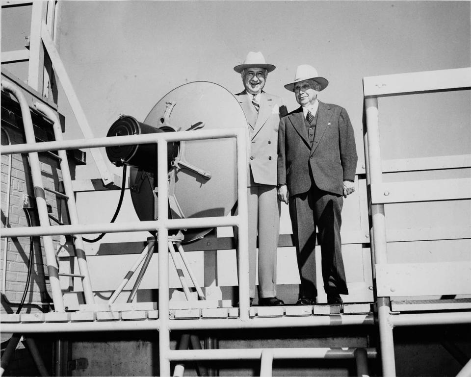 Amon G. Carter, Sr., (left), and R.E. Harding, owners of new WBAP-TV television station; on the roof of a building standing next to a transmitter, 11/08/1948