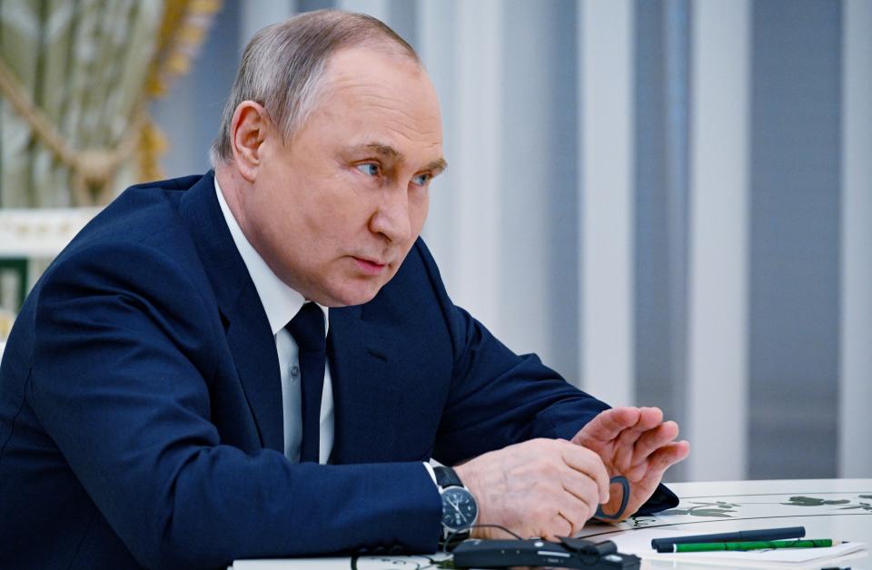 Russian President Vladimir Putin speaks to U.N. Secretary-General Antonio Guterres during their meeting in the Kremlin, in Moscow, Russia, Tuesday, April 26, 2022. (Vladimir Astapkovich, Sputnik, Kremlin Pool Photo via AP)