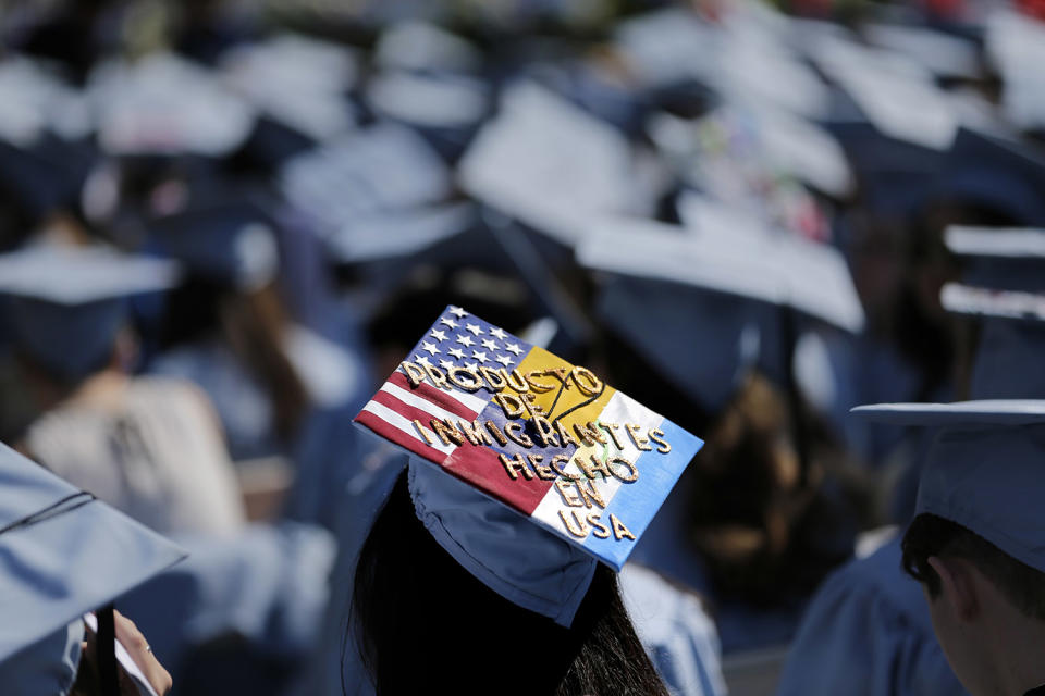 <p>A graduate displays a hat reading “Producto de Inmigrantes – Hecho en USA” during the Columbia University graduation ceremony in New York, May 17, 2017. Over 14,000 students graduated during the ceremonies. (Photo:Seth Wenig/AP) </p>