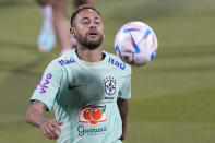 Brazil's Neymar practices during a training session at the Grand Hamad stadium in Doha, Qatar, Sunday, Nov. 20, 2022. Brazil will play their first match in the World Cup against Serbia on Nov. 24. (AP Photo/Andre Penner)