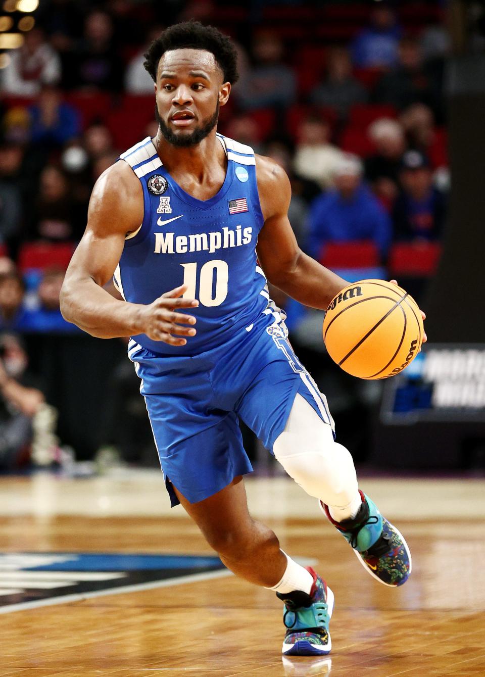 PORTLAND, OREGON - MARCH 17: Alex Lomax #10 of the Memphis Tigers dribbles during the first half against the Boise State Broncos in the first round game of the 2022 NCAA Men's Basketball Tournament at Moda Center on March 17, 2022 in Portland, Oregon. (Photo by Ezra Shaw/Getty Images)