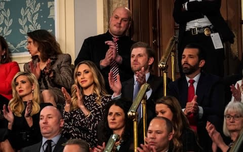 Ivanka Trump, Lara Trump, Eric Trump, and Donald Trump Jr. sit together to hear the address  - Credit: AFP