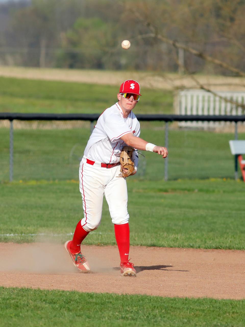 Ben Fox throws out a runner at first base during Sheridan's 8-1 win against visiting Philo on April 16 in Thornville. Sheridan earned the No. 3 seed in Sunday's Division II Southeast District sectional tournament drawing.