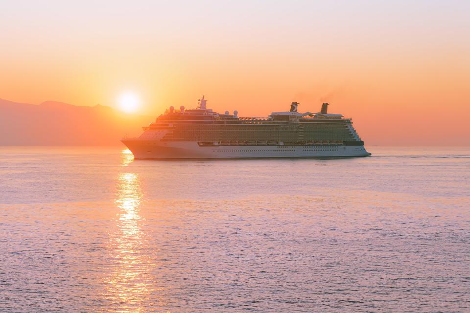 Cruise ship at sea at sunrise