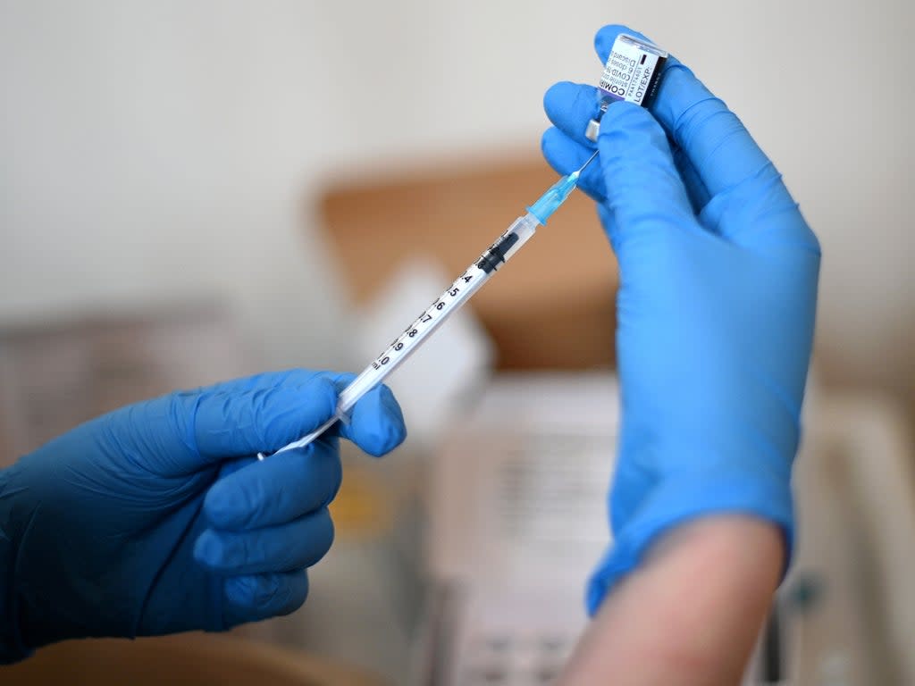 A clinician prepares a dose of a Pfizer Covid-19 vaccine in west London (Daniel Leal/AFP via Getty Images)