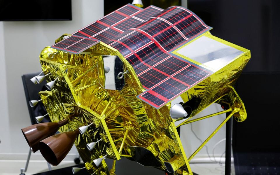 A miniature model of the full-size SLIM spacecraft, which weighed 700kg at launch, is displayed at Japan Aerospace Exploration Agency facility in Sagamihara, Japan