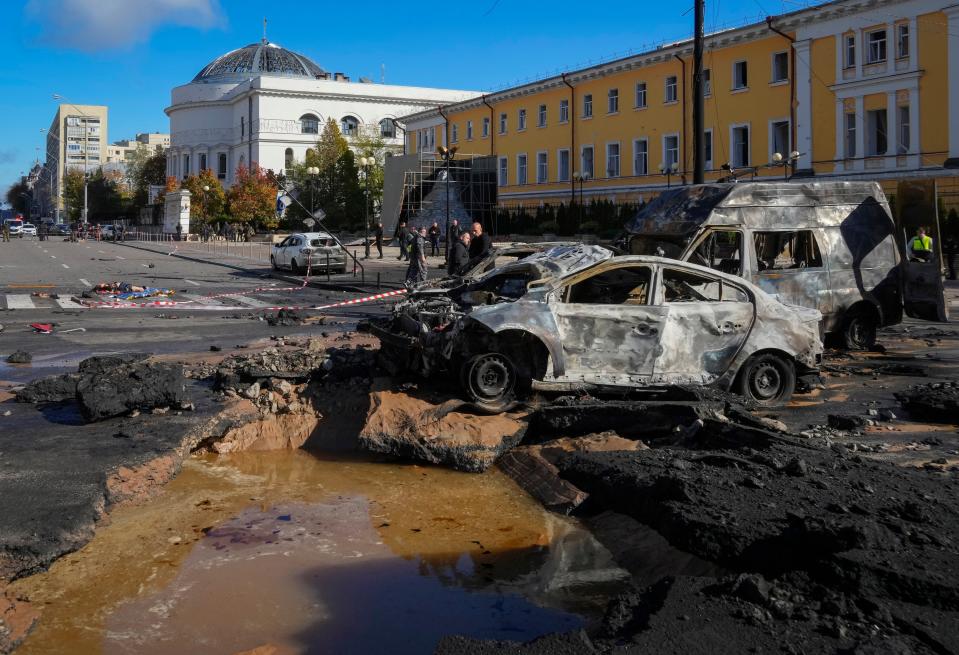 Police inspect the scene of Russian shelling in Kyiv, Ukraine (AP)