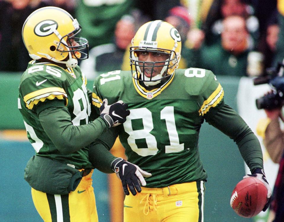 Green Bay Packers special teams member Tyrone Davis (81) is congratulated by Terry Mickens after recovering a Green Bay punt at the goalline for a touchdown in the first quarter against the Buffalo Bills at Lambeau Field in Green Bay, Wisconsin December 20.

SPORT NFL