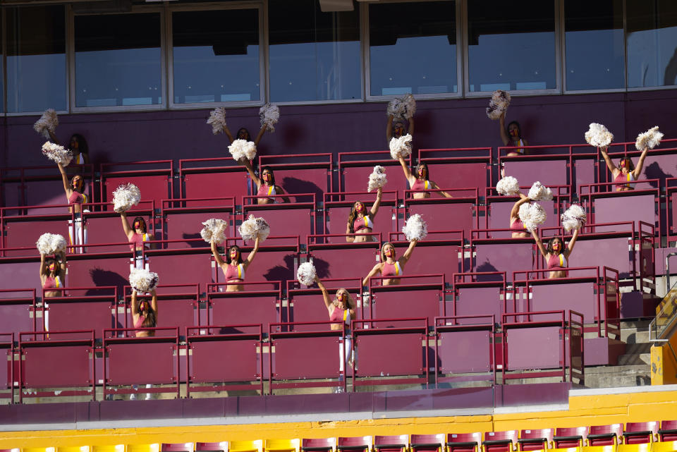 Members of the Washington Football Team cheerleading squad performing in an empty seating section at FedEx Field during the first half of an NFL football game between the New York Giants and Washington Football Team, Sunday, Nov. 8, 2020, in Landover, Md. (AP Photo/Patrick Semansky)