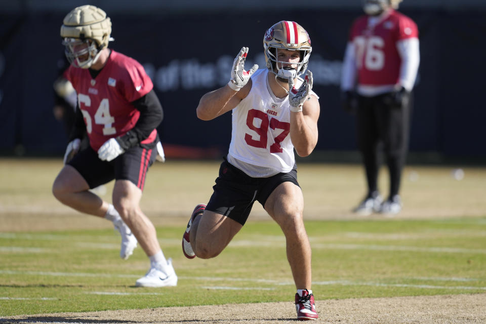 San Francisco 49ers defensive end Nick Bosa, right, and center Jake Brendel take part in NFL football practice in Santa Clara, Calif., Thursday, Jan. 25, 2024. The 49ers are scheduled to play the Detroit Lions Sunday in the NFC championship game. (AP Photo/Jeff Chiu)