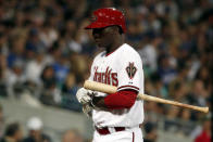 FILE PHOTO: Arizona Diamondbacks player Didi Gregorius walks off the field after being struck out during the opening game against the Los Angeles Dodgers of the 2014 Major League Baseball season at the Sydney Cricket Ground March 22, 2014. REUTERS/David Gray