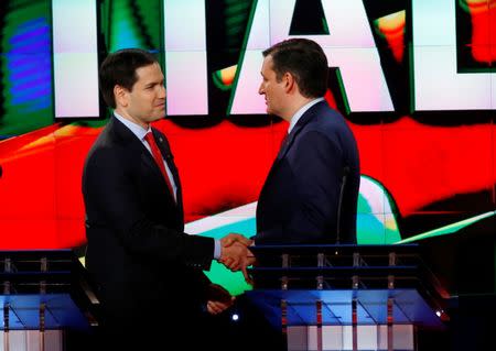 Republican U.S. presidential candidates Marco Rubio (L) and Ted Cruz shake hands at the conclusion of the debate sponsored by CNN for the 2016 Republican U.S. presidential candidates in Houston, Texas, February 25, 2016. REUTERS/Mike Stone