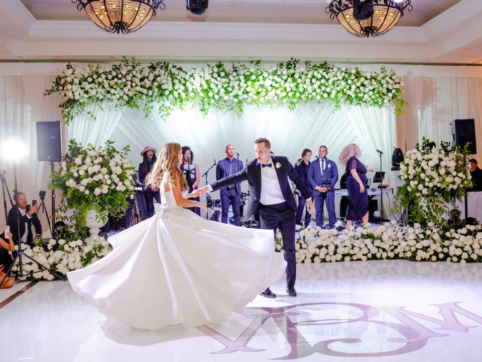 A bride and groom dance at their wedding reception.