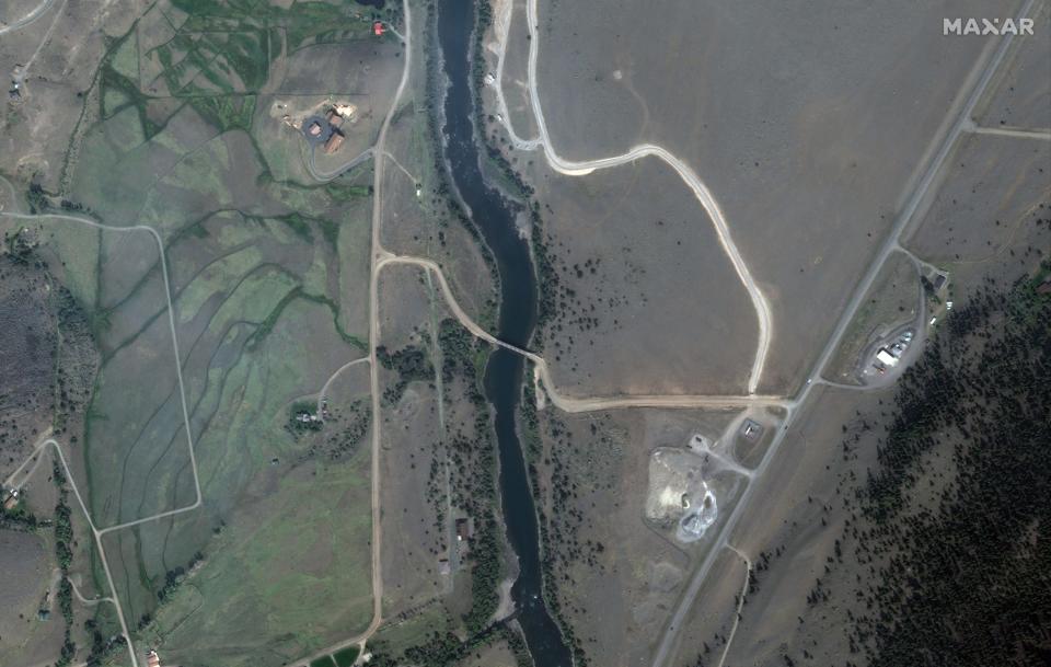 satellite image blue yellowstone river below road bridge