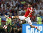 <p>Alexander Yerokhin almost does the splits as he controls the ball </p>