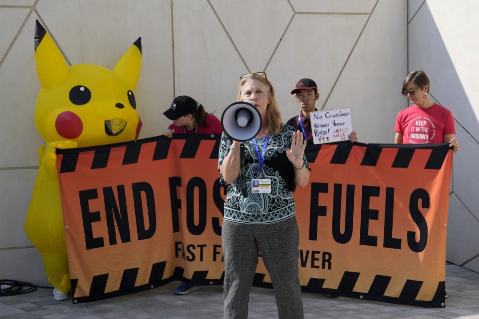 Melanie Oldham leads activists in a demonstration against fossil fuels at the COP28 U.N. Climate Summit, Sunday, Dec. 10, 2023, in Dubai, United Arab Emirates. (AP Photo/Kamran Jebreili)