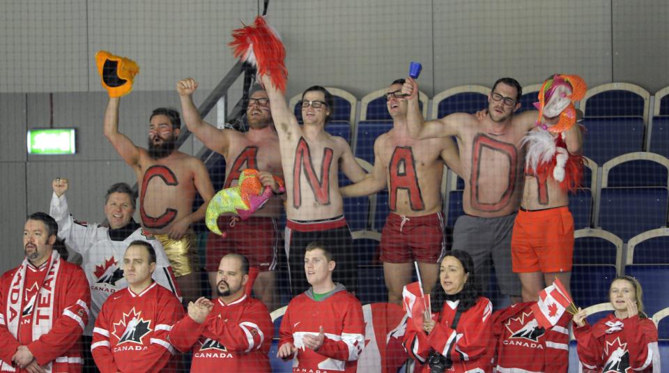 Canada supporters cheer their team from the stands during the World Junior Hockey Championships quarter final between Canada and Switzerland at the Malmo Stadium in Malmo, Sweden, on Thursday, Jan. 2, 2014. Canada won the match 4-1 and is ready for the semifinal Saturday. (AP Photo / TT News Agency / Bjorn Lindgren) SWEDEN OUT