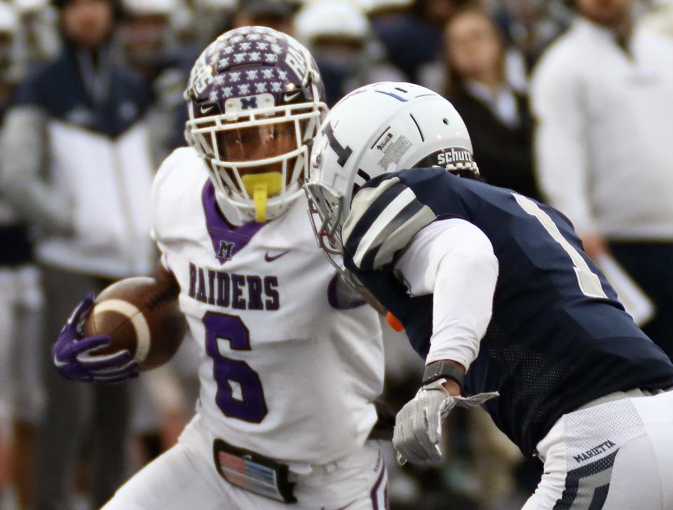 Mount Union Wayne Ruby Jr., left, and Marietta's Tay Pryor, right, in action at Don Drumm Stadium Saturday, November 13, 2021.