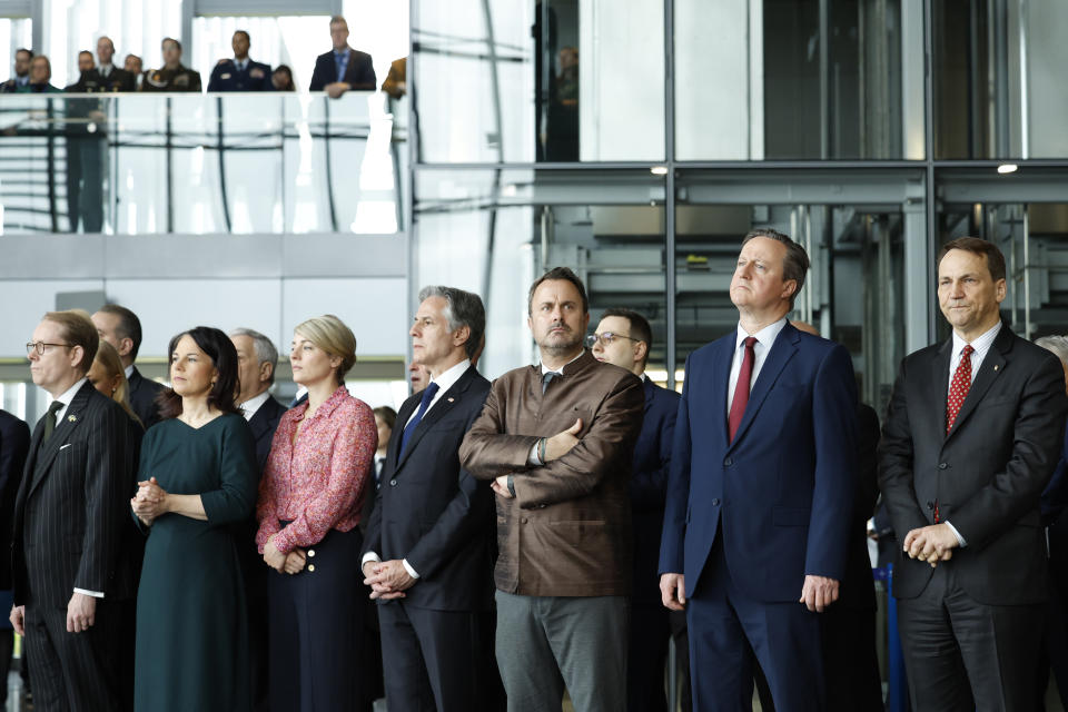 From left, Sweden's Foreign Minister Tobias Billstrom, Germany's Foreign Minister Annalena Baerbock, Canada's Foreign Minister Melanie Joly, United States Secretary of State Antony Blinken, Luxembourg's Foreign Minister Xavier Bettel, British Foreign Secretary David Cameron and Poland's Foreign Minister Radoslaw Sikorski attend a ceremony to mark the 75th anniversary of NATO at NATO headquarters in Brussels, Thursday, April 4, 2024. NATO marked on Thursday 75 years of collective defense across Europe and North America, with its top diplomats vowing to stay the course in Ukraine as better armed Russian troops assert control on the battlefield. (AP Photo/Geert Vanden Wijngaert)