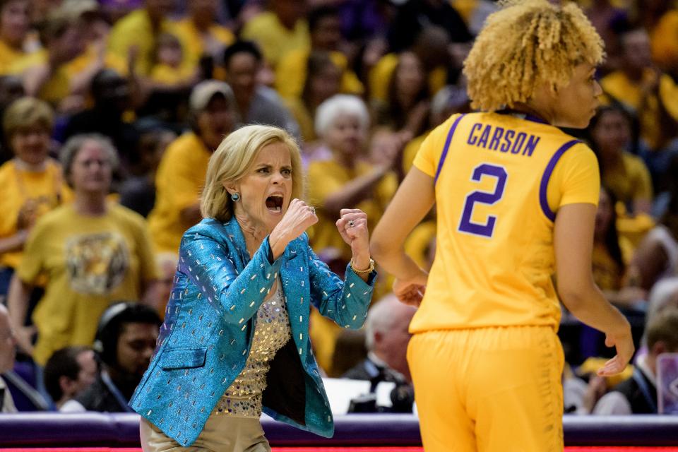 LSU coach Kim Mulkey in a Queen of Sparkles jacket during her team's game against Mississippi State in late February.