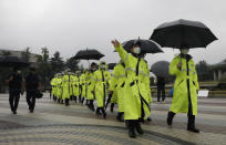 South Korean police officers wearing face masks walk in Seoul, South Korea, Saturday, Aug. 15, 2020. South Korea on Saturday announced stronger social distancing restrictions for its greater capital area where a surge in COVID-19 cases has threatened to erase the hard-won gains against the virus. (AP Photo/Lee Jin-man)