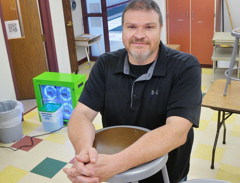 After a small fire at Elk Valley Elementary School, Principal Mike Trudnowski laments more time lost with students as remote learning will likely last through the end of the school year. Trudnowski, 47, visits an art classroom where one of many air purifiers, left, is used to help clean the building.