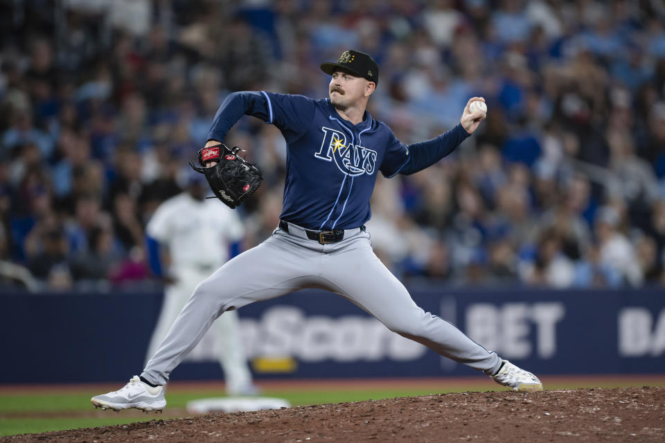 Tampa Bay Rays pitcher Tyler Alexander (14) throws to a Toronto Blue Jays batter during the seventh inning of a baseball game Friday, May 17, 2024, in Toronto. (Christopher Katsarov/The Canadian Press via AP)