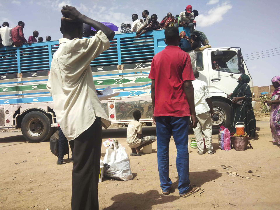 People board a truck as they leave Khartoum, Sudan, Monday, June 19, 2023. Sudan's warring parties have begun another attempt at a cease-fire after more than two months of brutal fighting — and ahead of an international conference to raise funds for humanitarian assistance. (AP Photo)