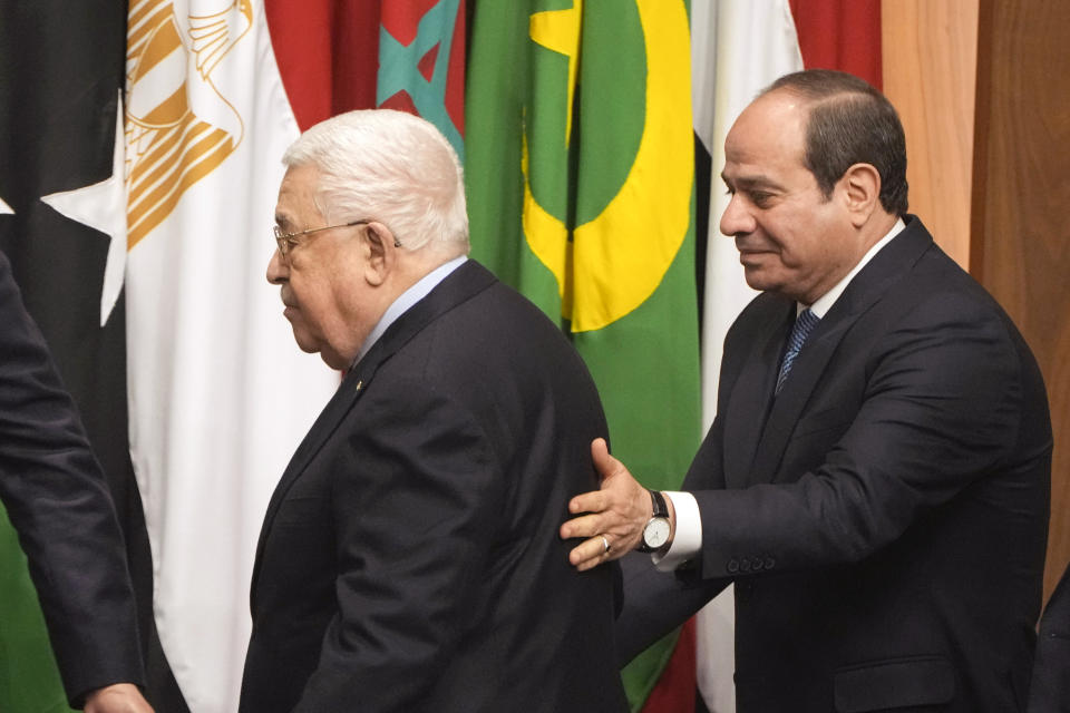 Egyptian President Abdel-Fattah el-Sissi, right, greets Palestinian President Mahmoud Abbas, during a conference to support Jerusalem at the Arab League headquarters in Cairo, Egypt, Sunday, Feb. 12, 2023. (AP Photo/Amr Nabil)