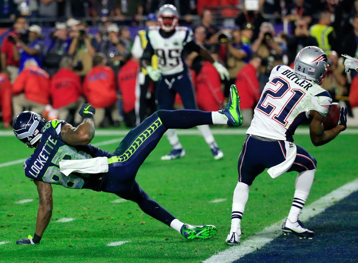 Malcolm Butler #21 of the New England Patriots intercepts a pass by Russell Wilson #3 of the Seattle Seahawks intended for Ricardo Lockette #83 late in the fourth quarter during Super Bowl XLIX