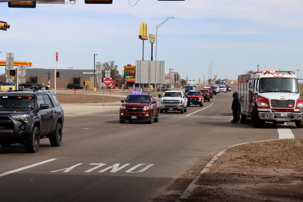The body of Fritch Volunteer Fire Department Chief Zeb Smith is escorted through Amarillo Tuesday, as the convoy makes its way from Borger to Lubbock. Smith suffered a medical emergency and died while fighting a fire Tuesday, officials confirmed.