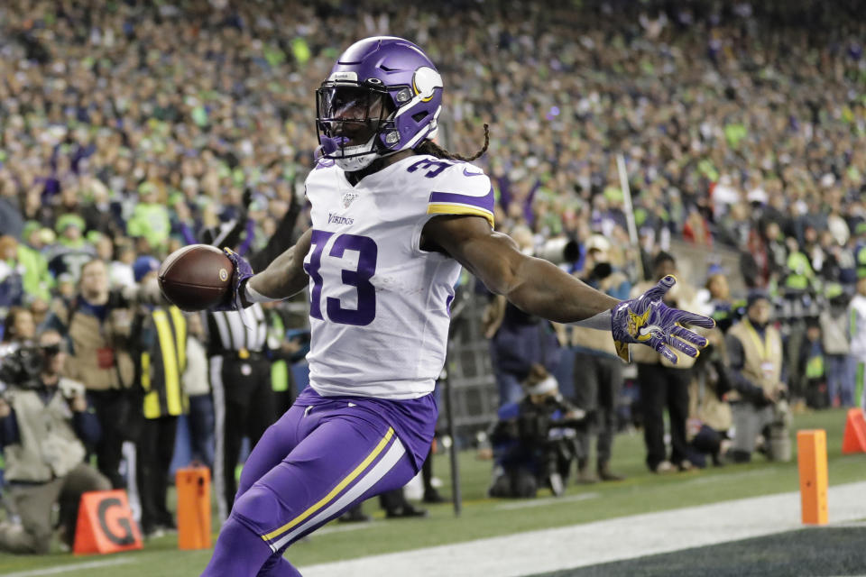 Minnesota Vikings' Dalvin Cook reacts after scoring against the Seattle Seahawks during the first half of an NFL football game, Monday, Dec. 2, 2019, in Seattle. (AP Photo/Ted S. Warren)