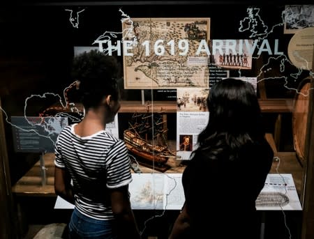 Visitors view the 1619 exhibit at the Hampton History Museum in Hampton, Virginia