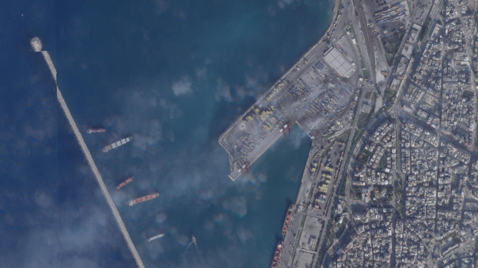This satellite photograph taken by Planet Labs PBC show the smoldering wreckage after an Israeli strike on the port at Latakia, Syria, Wednesday, Dec. 29, 2021. Firefighters contained a blaze that raged for hours in Syria's port of Latakia on Tuesday, officials said, hours after Israel launched missiles from the Mediterranean Sea, igniting the fire in the container terminal. It was the second such attack on the vital facility this month. (Planet Labs PBC via AP)