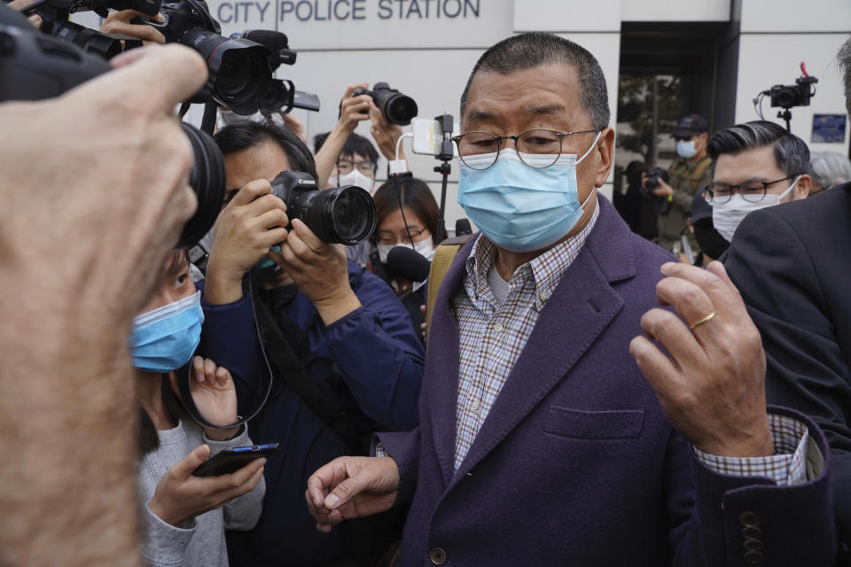 Founder of Hong Kong's Apple Daily newspaper, Jimmy Lai, walks out from a police station after being bailed out in Hong Kong, Friday, Feb. 28, 2020. Hong Kong's Apple Daily newspaper says the outspoken head of its publishing group, Lai, has been held by police over his participation in a protest march in August that was part of a months-long pro-democracy movement. (Lam Chun Tung/The Initium Media via AP)