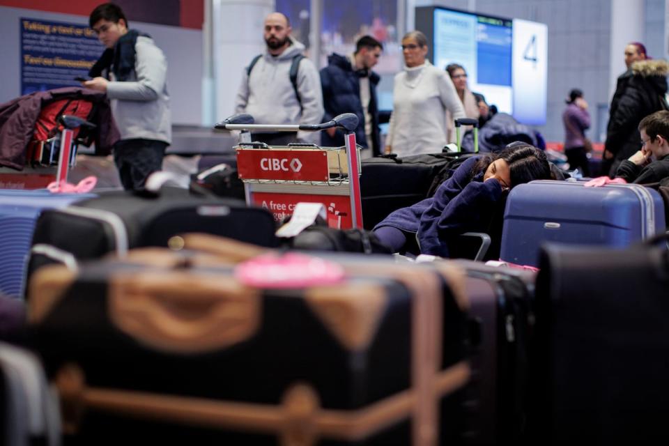 Travellers are pictured here at Pearson International Airport in Toronto.