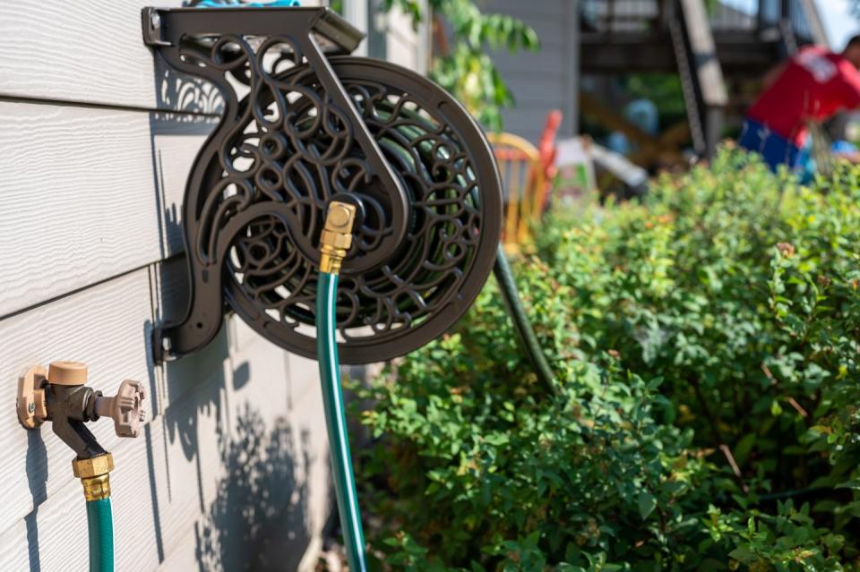 shed organization ideas hose hanger