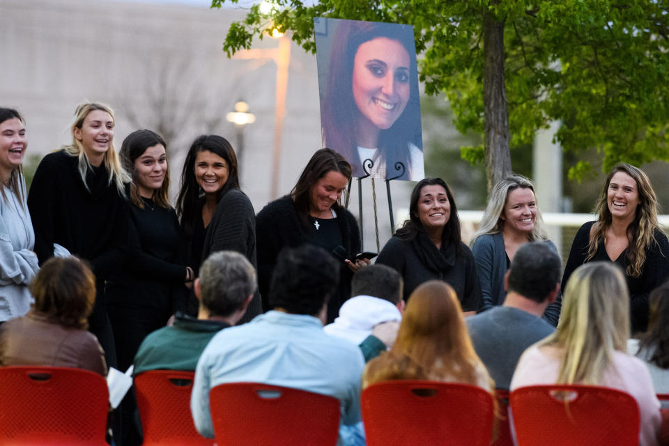 Members of the sorority Alpha Gamma Delta laugh as they talk about memories of Ms Josephson during a candlelight vigil in honour her life. Source: AAP