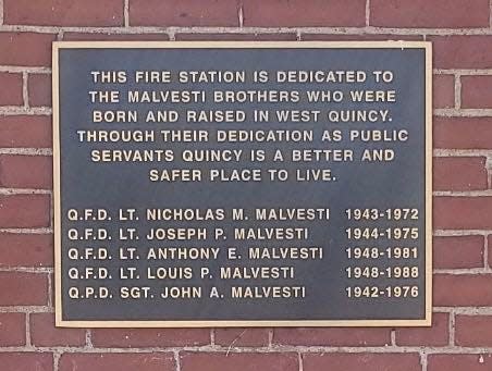 A plaque dedicating the West Quincy fire station to the Malvesti brothers, who are Michael Malvesti's grandfather and great-uncles.